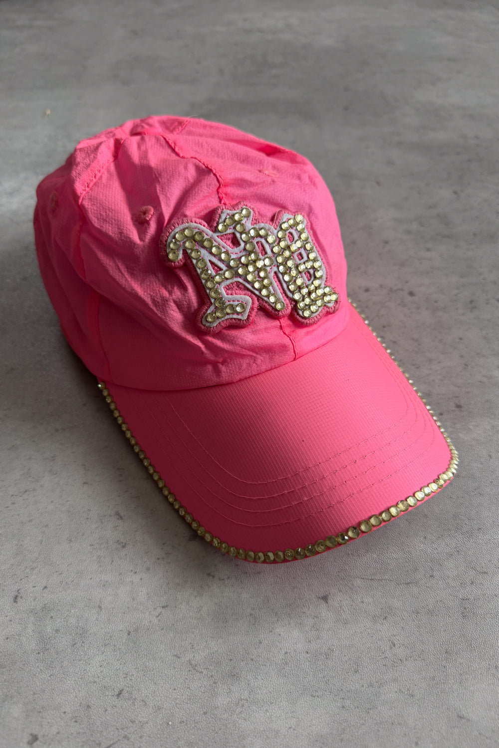 Pink neon diamante sequinned cap