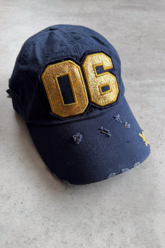 06 gold + navy cap