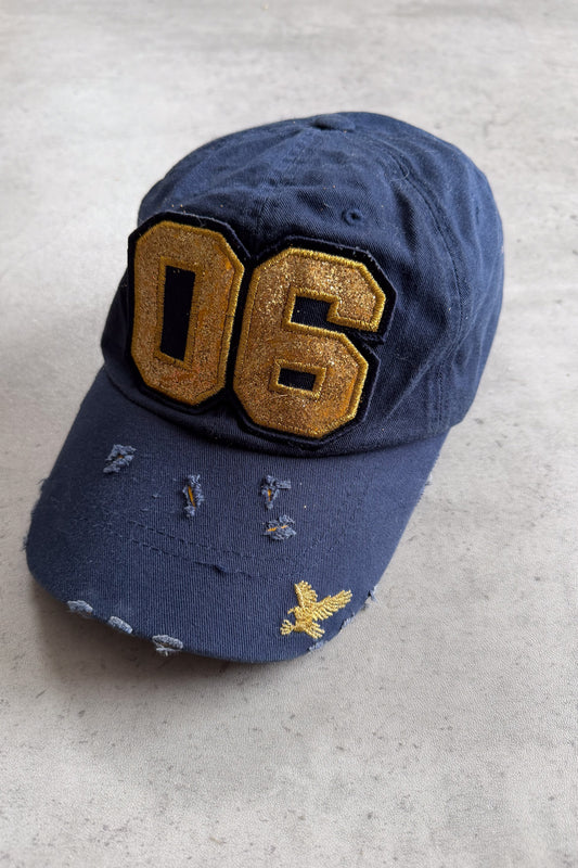 06 gold + navy cap