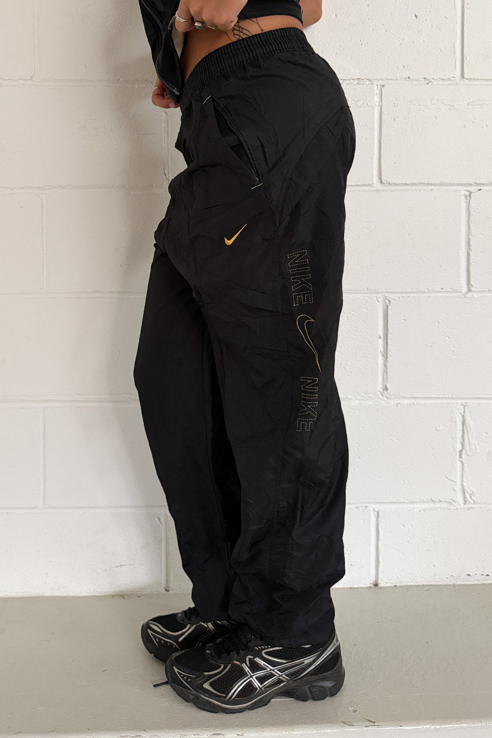 NIKE black + gold side logo track pants ★ Size est xs